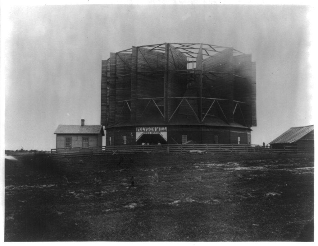 Barton mill - large polygon shaped structure rising about 3 or 4 stories above the ground.